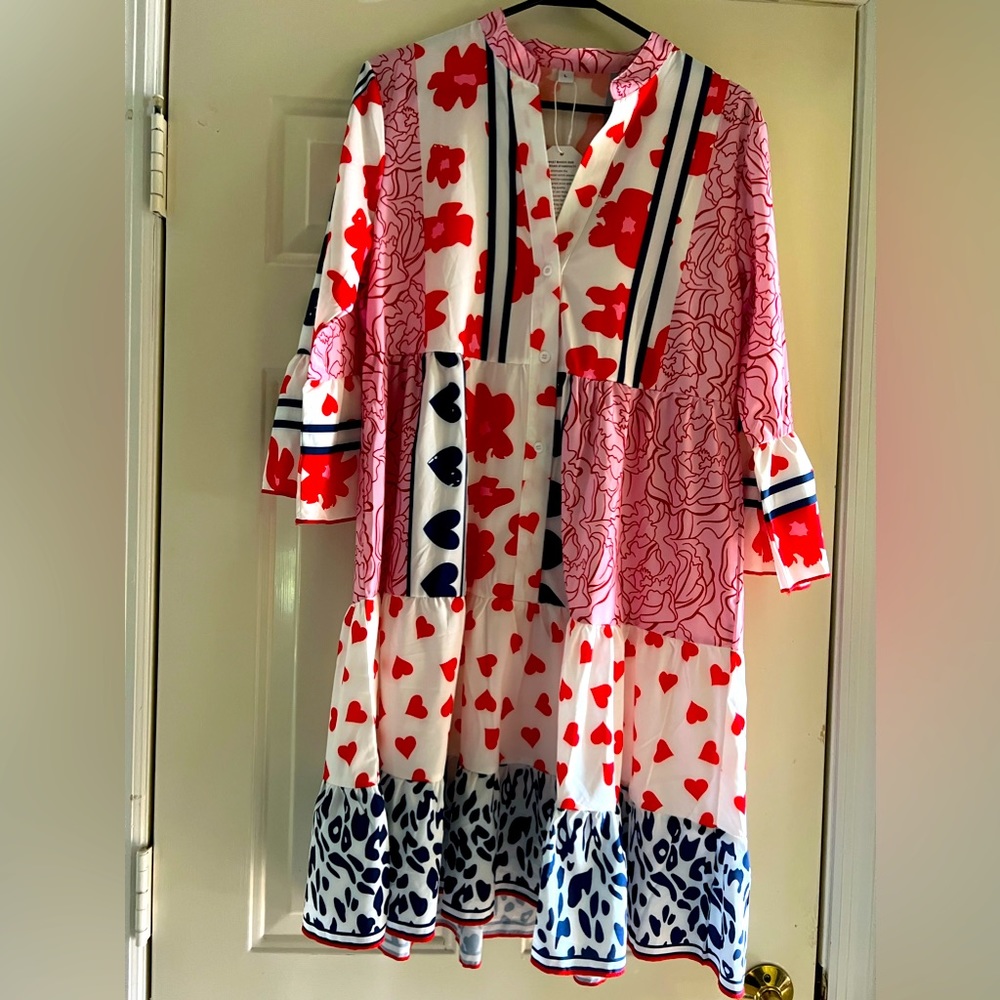 Red white, and blue patterned dress. Says large but will fit size 10 to 12.